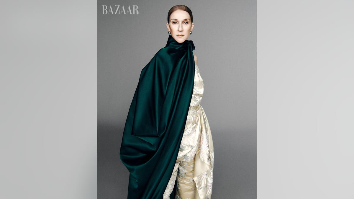 Celine Dion in green coat and gold dress