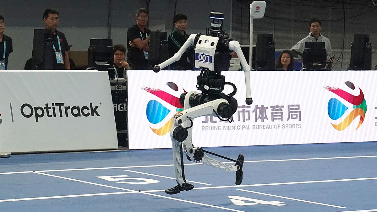 Robots from Team Tiangong Ultra compete in a relay race in Beijing.