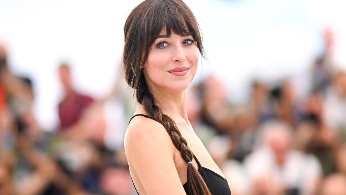 Dakota Johnson poses during the Splitsville photocall at Cannes Film Festival.