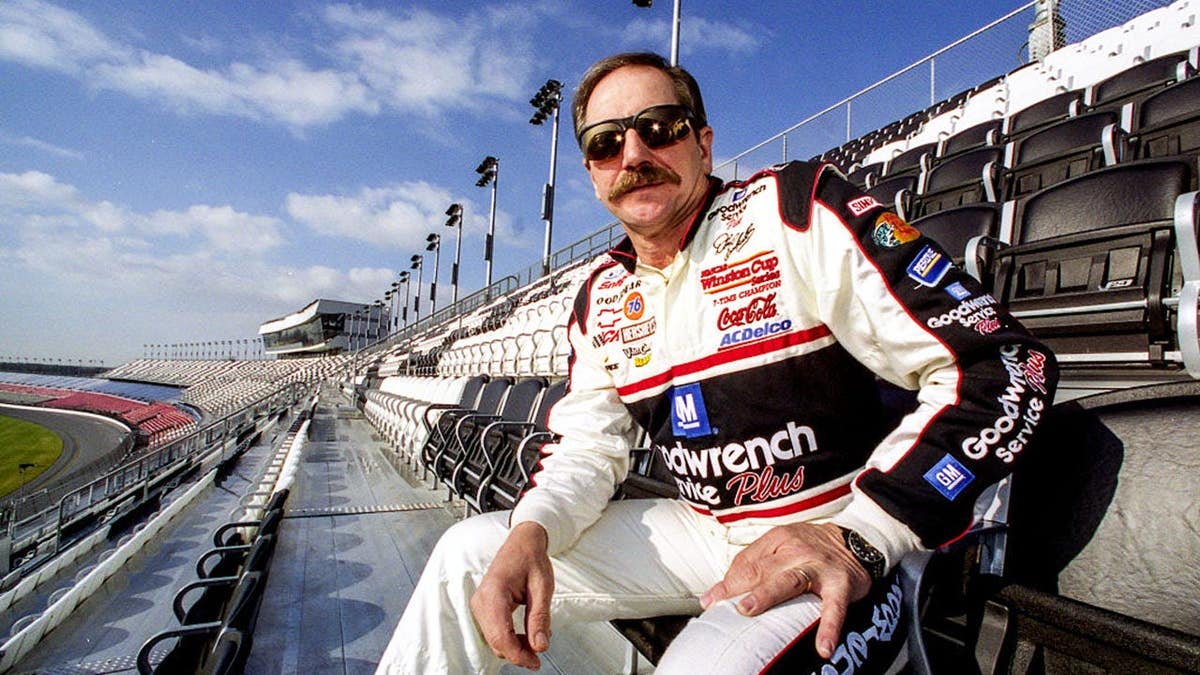 Dale Earnhardt stands at the Earnhardt Grandstand overlooking Daytona International Speedway.