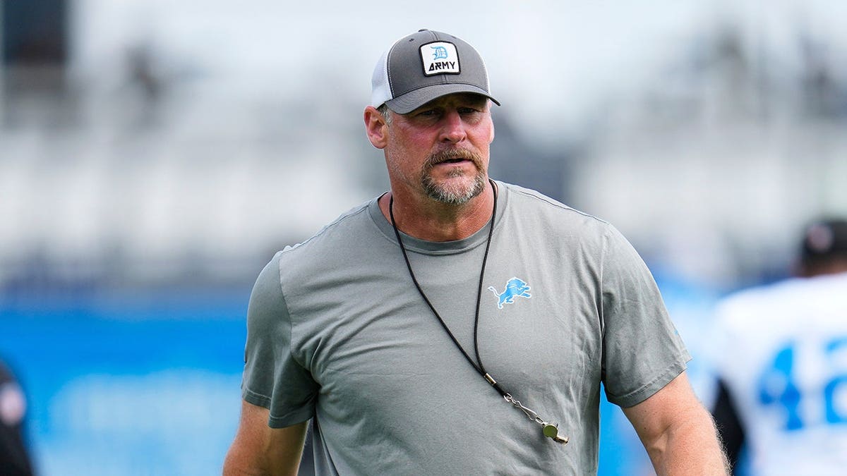 Dan Campbell watches during practice at NFL training camp.