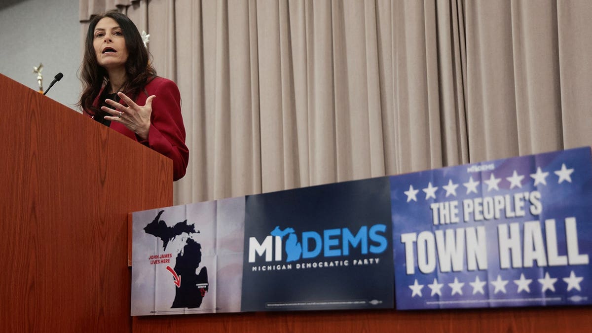 Dana Nessel speaks at a podium in Warren, Mich.