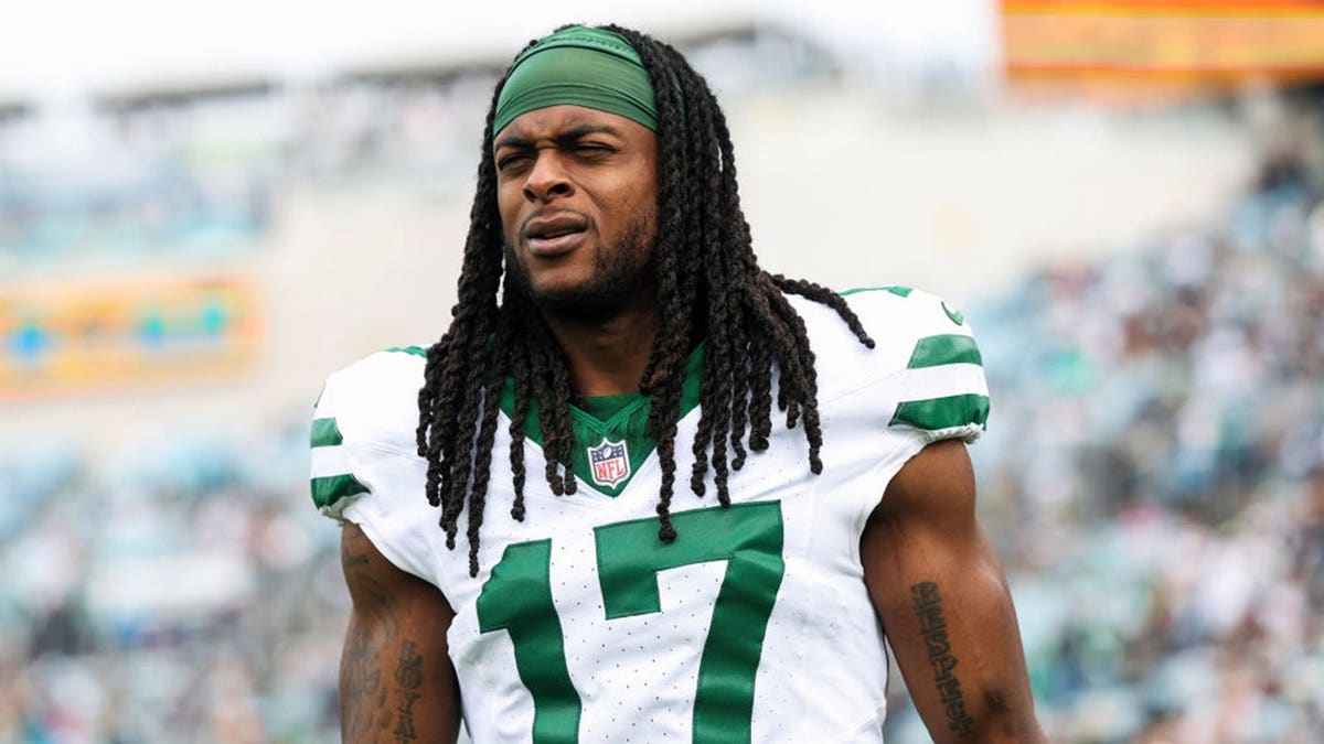 Davante Adams of the New York Jets looks on from the sideline.