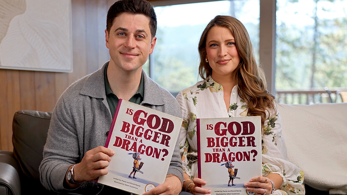 David and Maria Henrie hold up new book