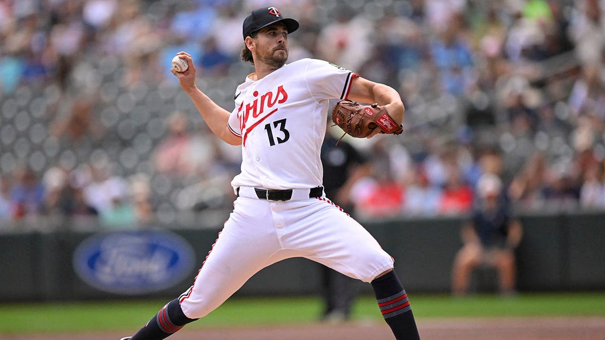 Dean Kremer delivers a pitch during a Minnesota Twins game at Target Field.