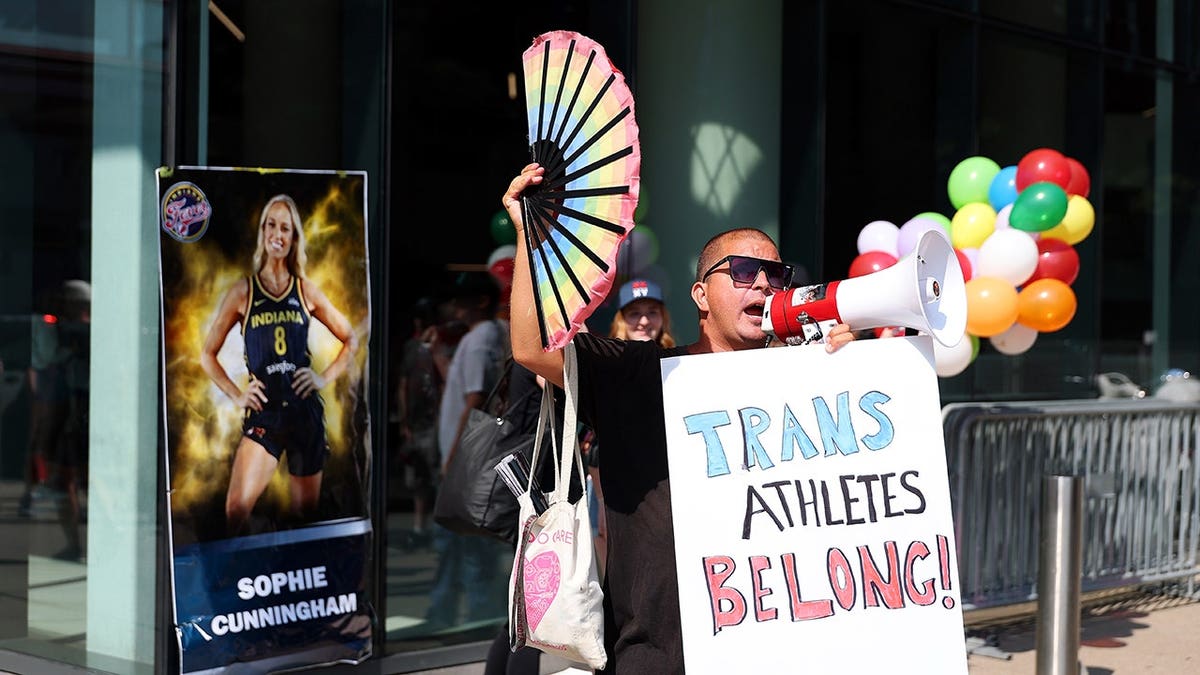 Demonstrator protests outside Target Center before a WNBA game between the Indiana Fever and Minnesota Lynx in Minneapolis.