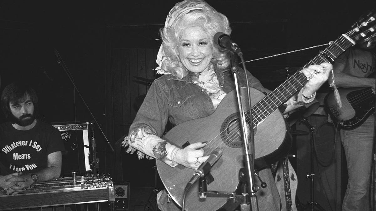 Dolly Parton rehearses on stage at the Bottom Line nightclub.