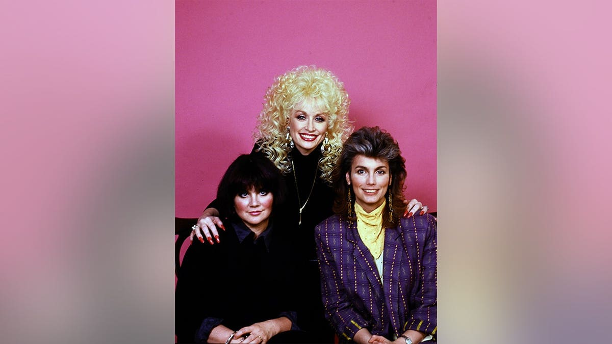 Linda Ronstadt, Dolly Parton and Emmylou Harris photographed together in Los Angeles in April 1987