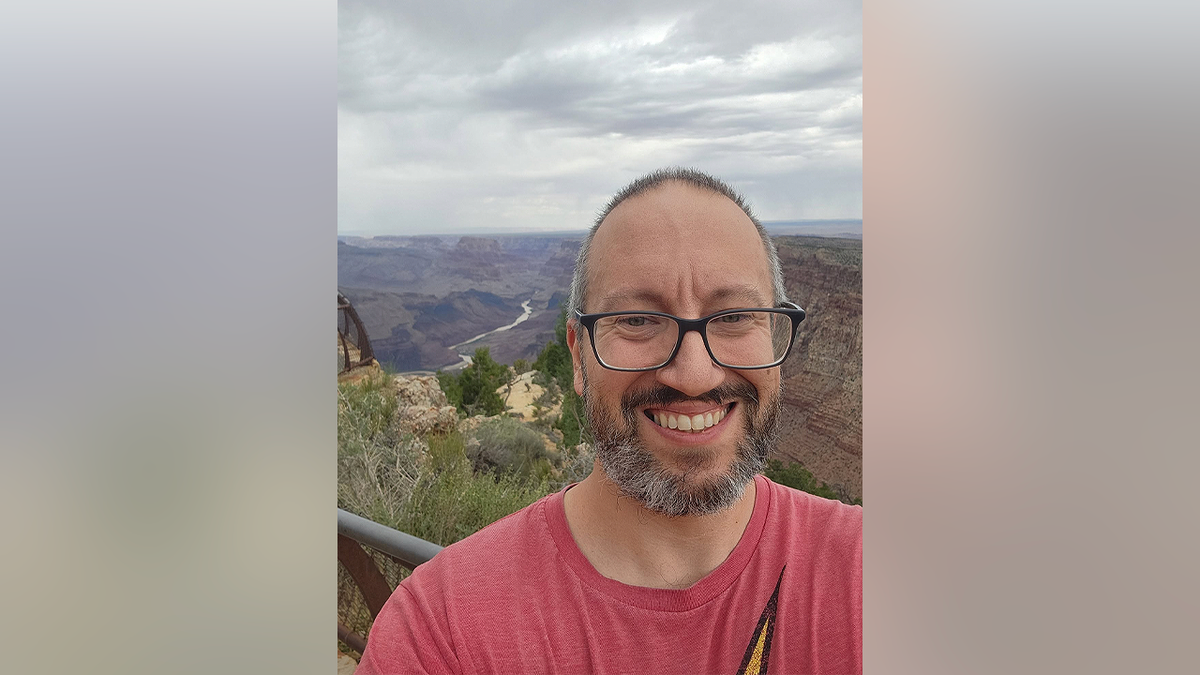 Texas chiropractor Dr. John Giusti takes a selfie overlooking the Grand Canyon during a hiking trip