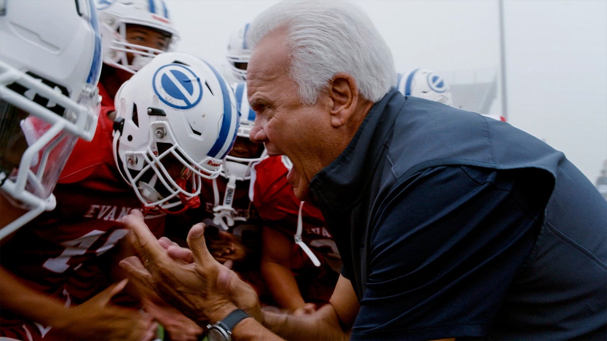 Denny Duron coaches football team