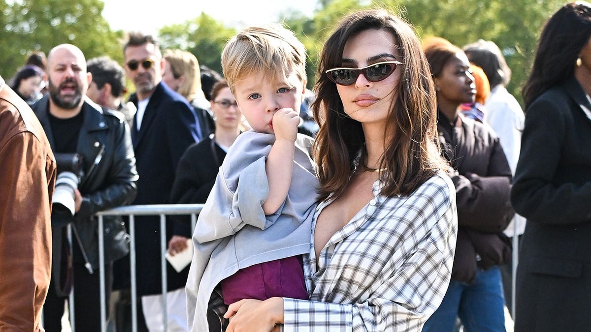 Emily Ratajkowski and Sylvester Apollo Bear attend the Loewe Paris Womenswear show.