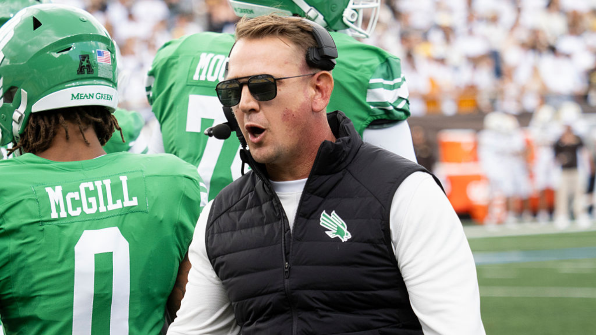 Eric Morris, North Texas Mean Green head coach, reacts on the sideline during a college football game.