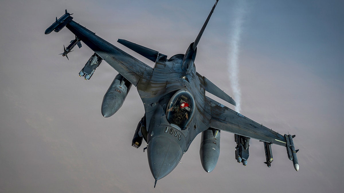 A U.S. Air Force F-16 Fighting Falcon craft  flies successful  the sky.