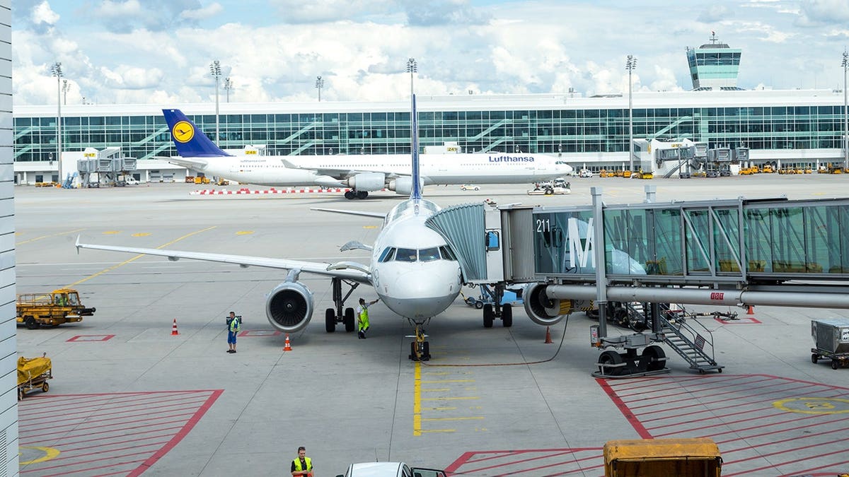 Panoramic view of Frankfurt Airport terminal and Lufthansa aircraft in Frankfurt, Germany.