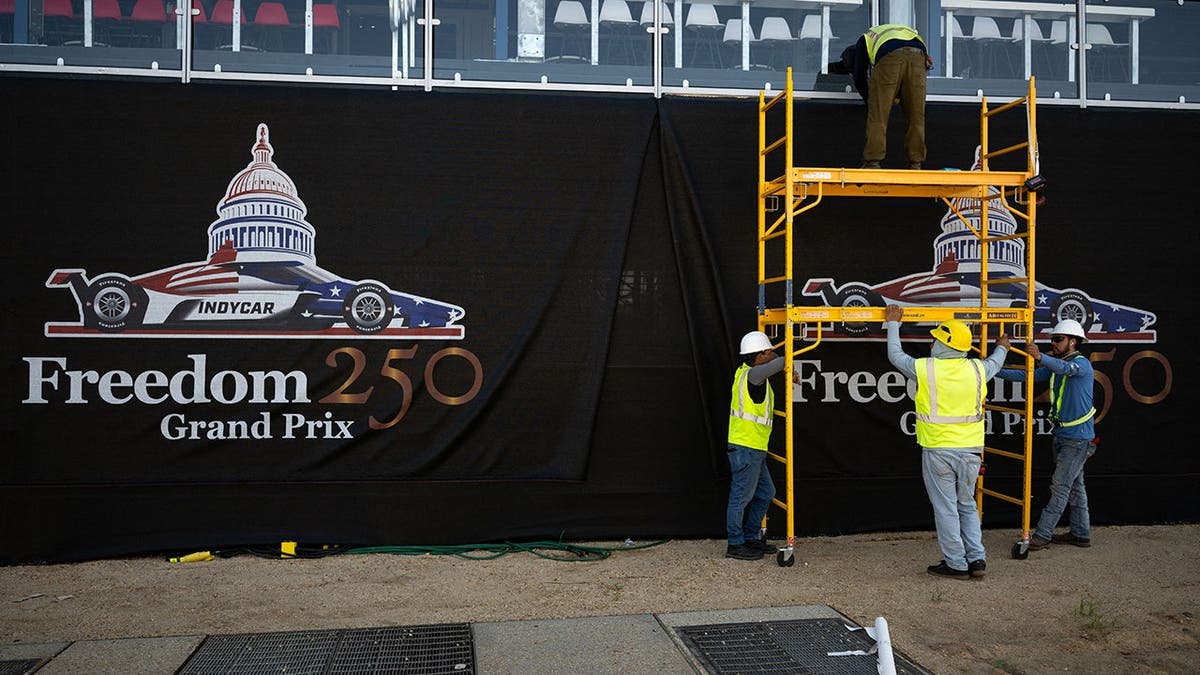 Workers set up on the National Mall in Washington, D.C., ahead of the Freedom 250 Grand Prix.
