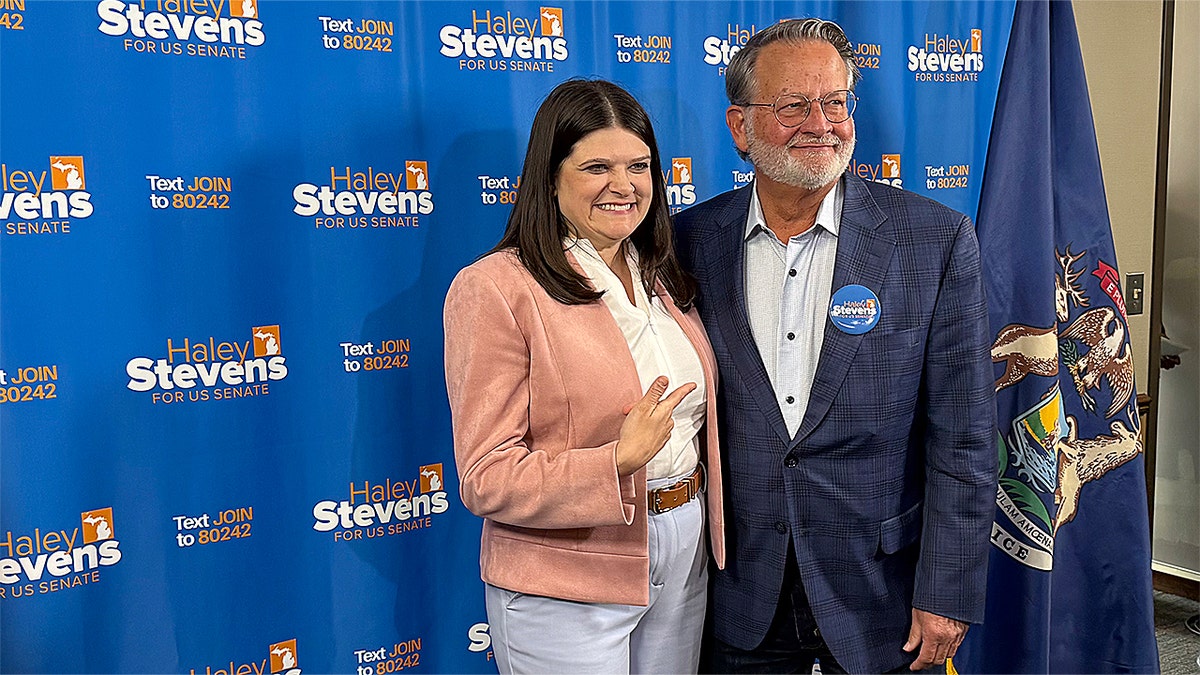 Haley Stevens and Gary Peters take questions from the press