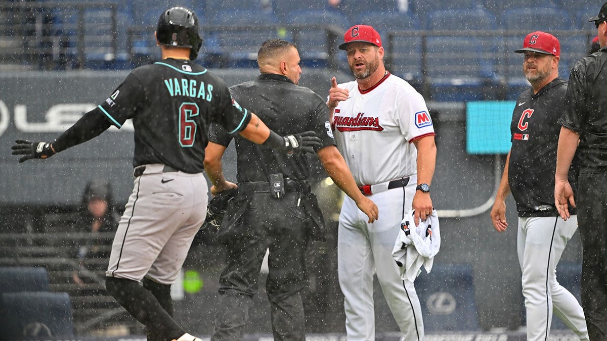 Ildemaro Vargas of the Arizona Diamondbacks argues with Cleveland Guardians manager Stephen Vogt.