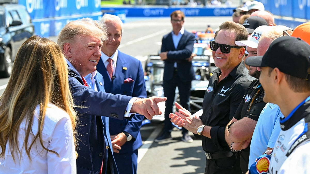 Donald Trump greets drivers at the Freedom 250 Grand Prix