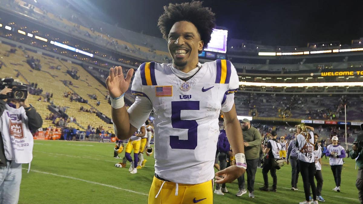 Jayden Daniels #5 reacts after a game at Tiger Stadium.