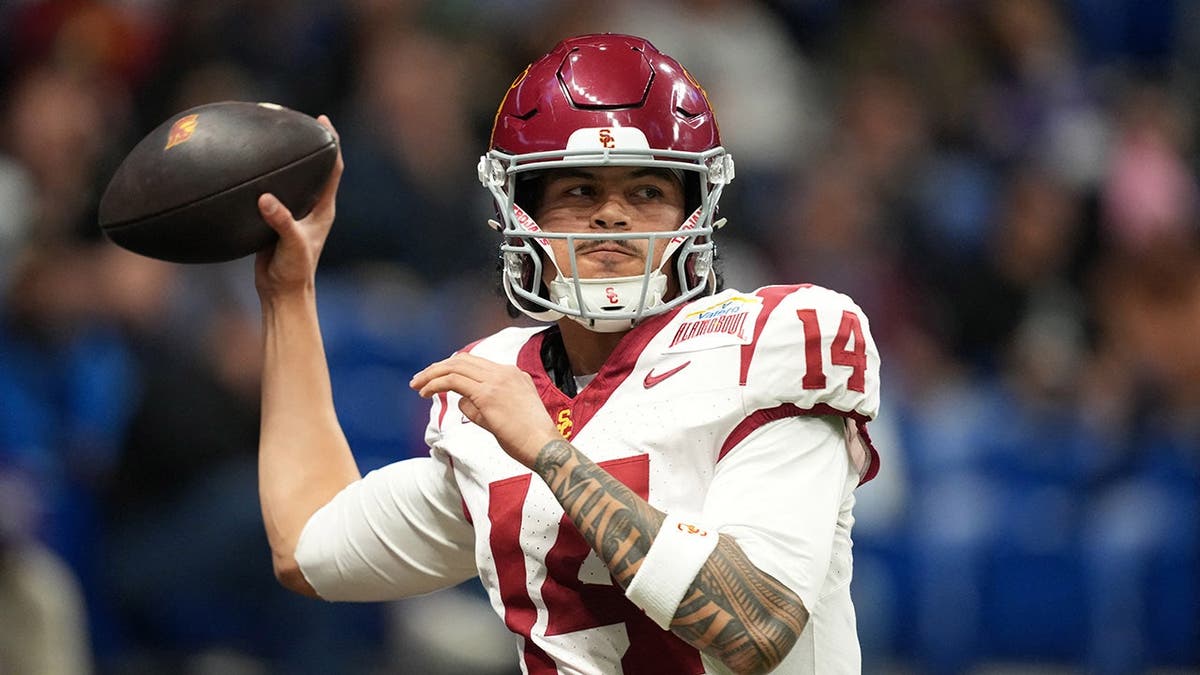 Jayden Maiava, Southern California quarterback, throws the ball against TCU in the first half.