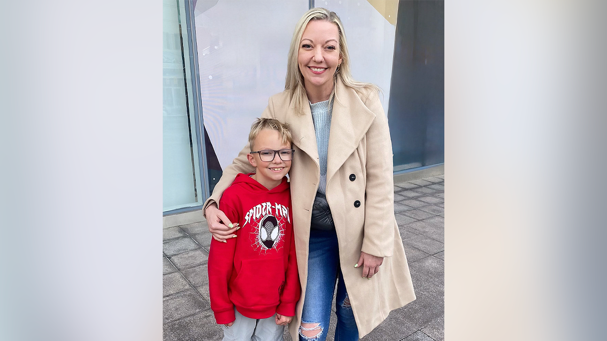 Jessica Orton Lyman poses with her son Eli Painter in a family photo