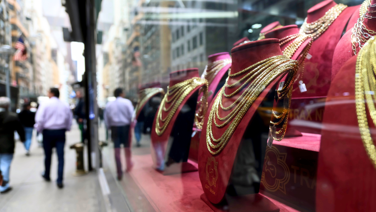 Gold necklaces in the window of a jewelry store in the Diamond District neighborhood of New York, US, on Wednesday, Oct. 8, 2025.