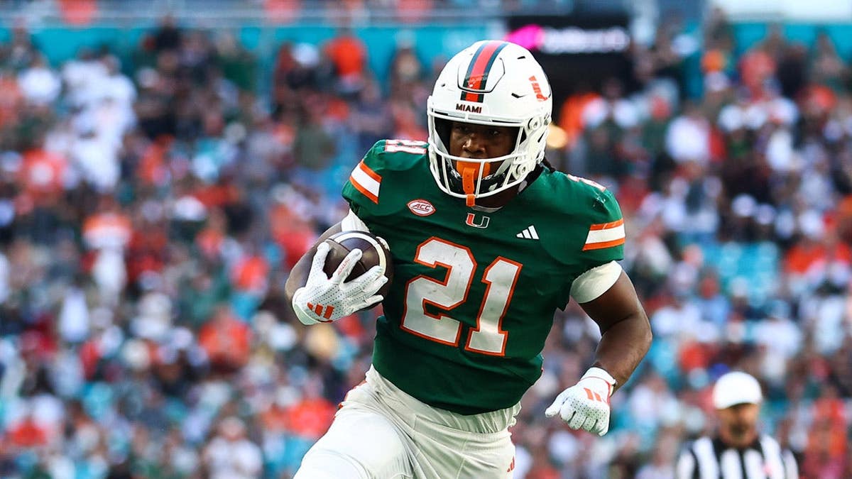 Jordan Lyle carries the ball for a touchdown against Wake Forest during a game at Hard Rock Stadium.