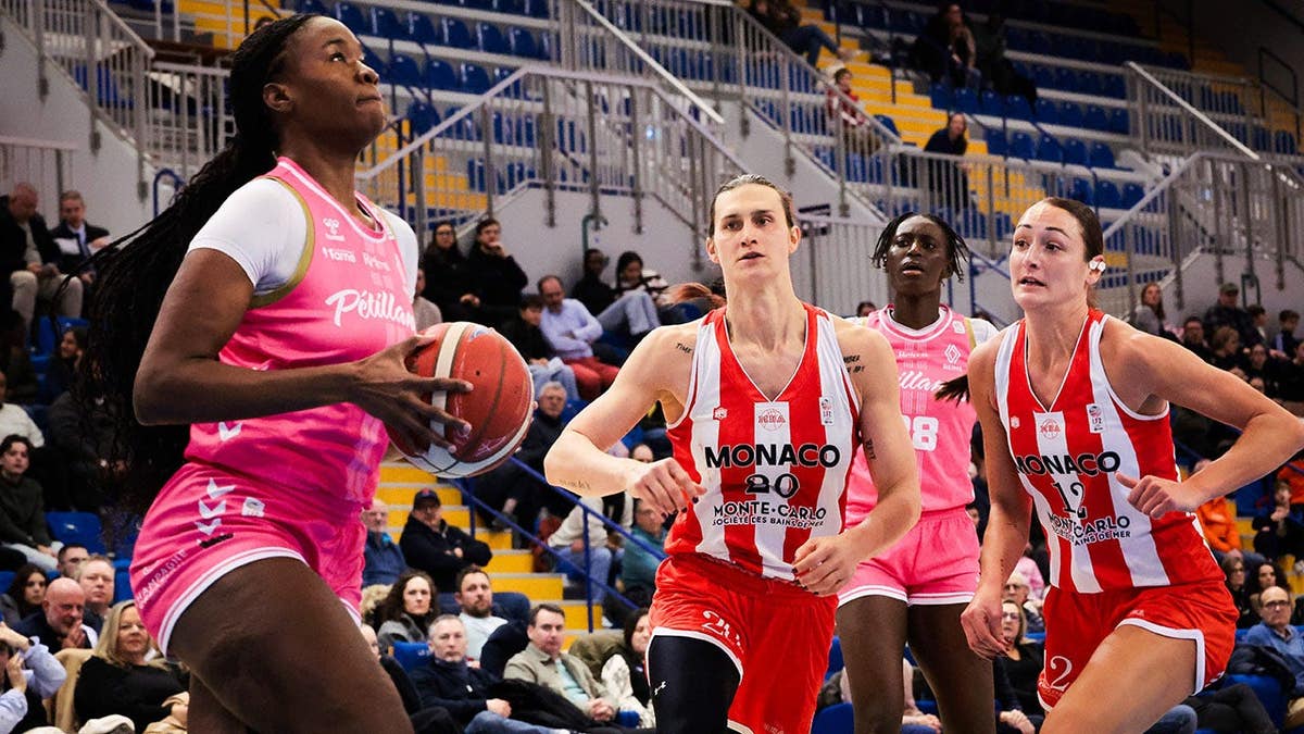 Julie Tetart plays basketball during a French second-division game in Reims, France.