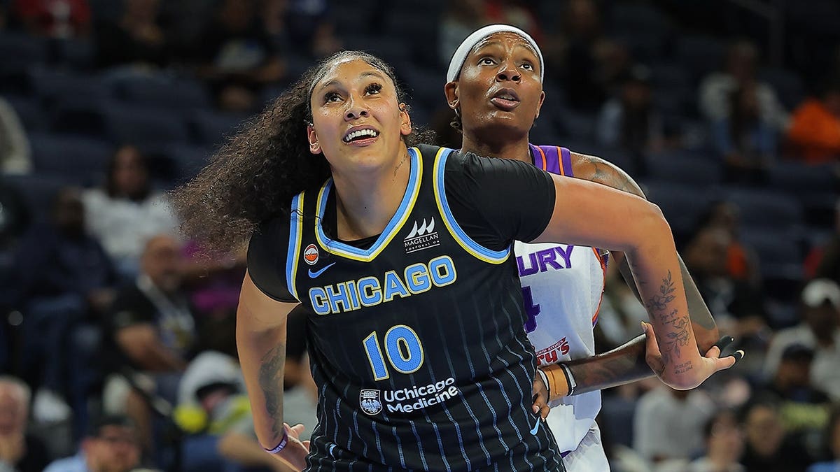 Kamilla Cardoso boxes out Natasha Mack during a Chicago Sky game.