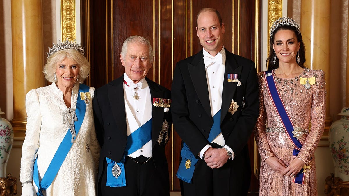 King Charles III, Queen Camilla, Prince William and Catherine pose for a photograph at Buckingham Palace.
