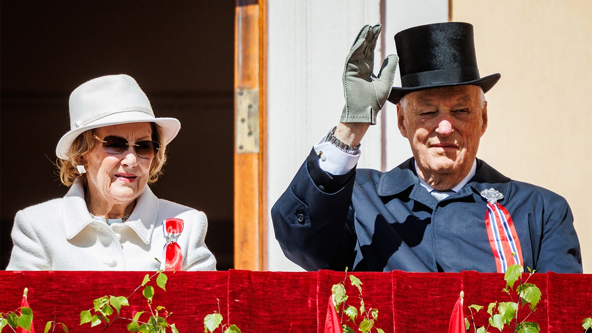 Her Majesty Queen Sonja of Norway (L) and His Majesty King Harald of Norway attend the Norwegian Constitution Day with the children's parade at the Royal Palace on May 17, 2026 in Oslo, Norway.
