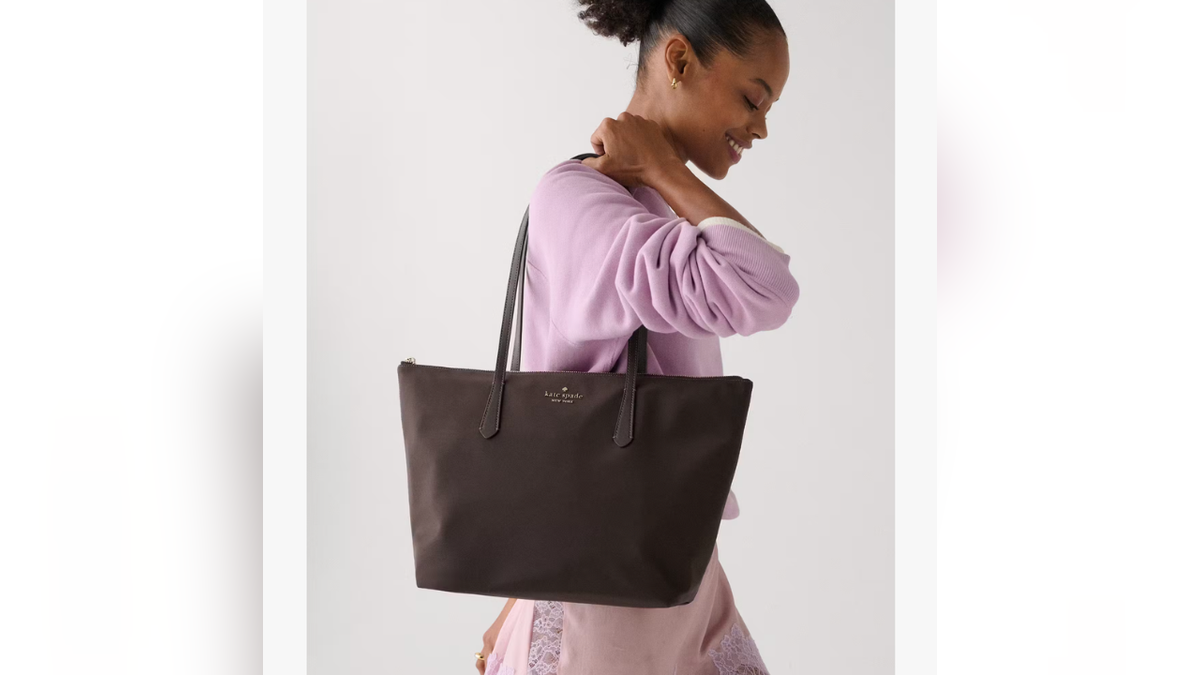 The Kitt Ksnyl Tote Bag is a roomy nylon tote made for everyday errands.