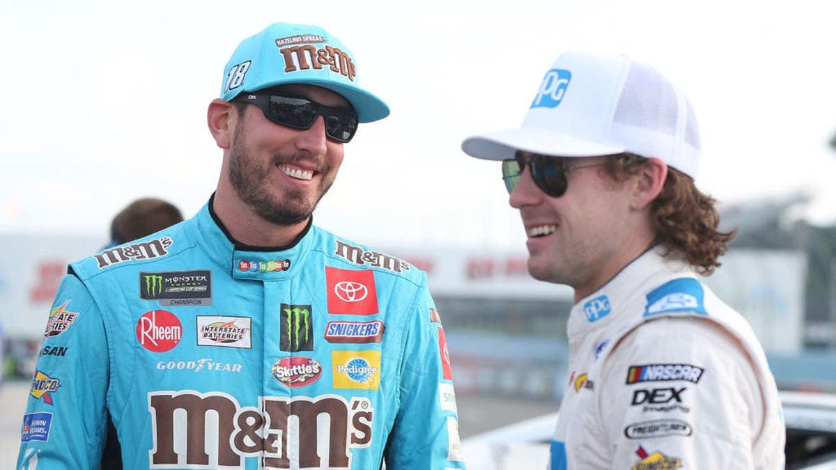 Kyle Busch and Ryan Blaney talk during NASCAR qualifying at Watkins Glen International.