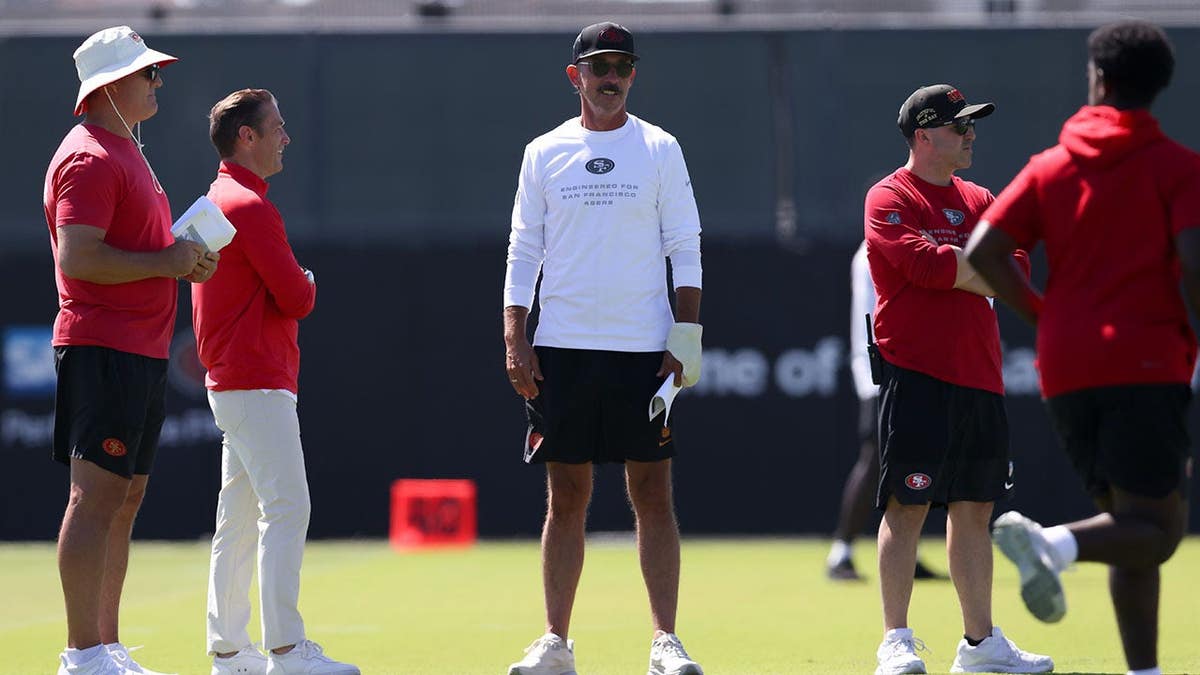 Kyle Shanahan stands during 49ers training camp at Levi's Stadium.