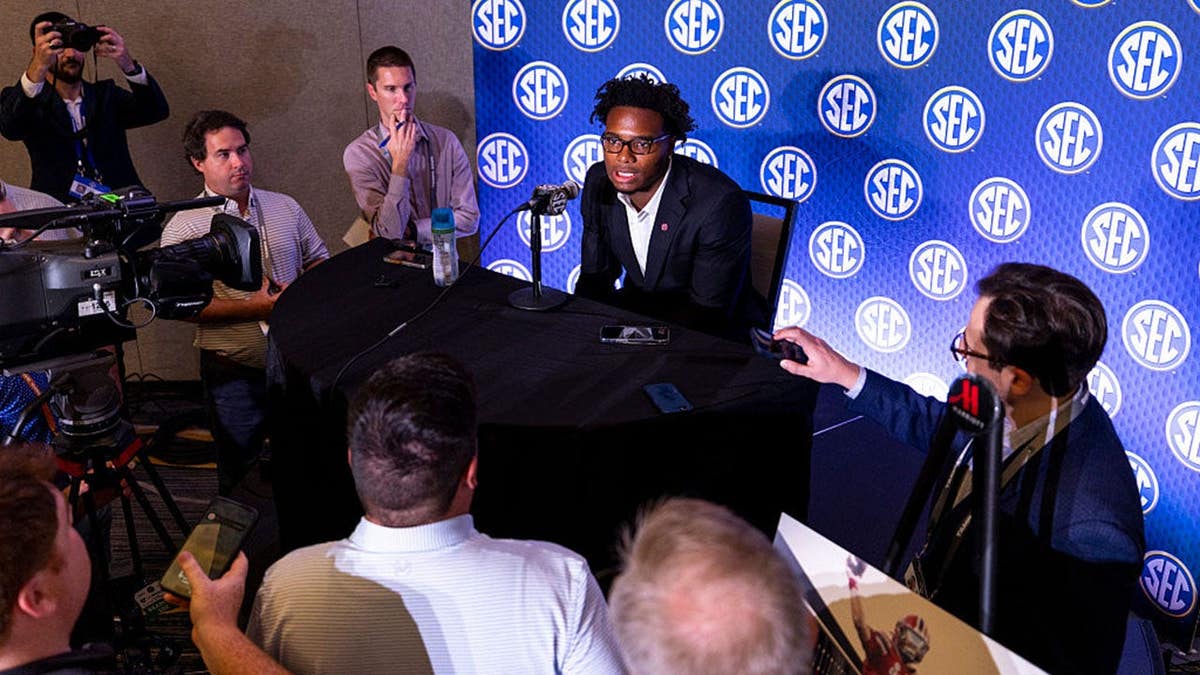 Quarterback LaNorris Sellers speaks at a podium during SEC Football Media Day.