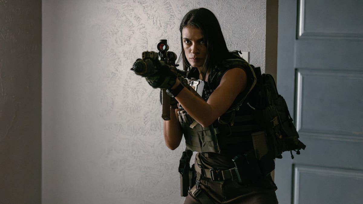 Laysla De Oliveira stands as Cruz in Lioness.