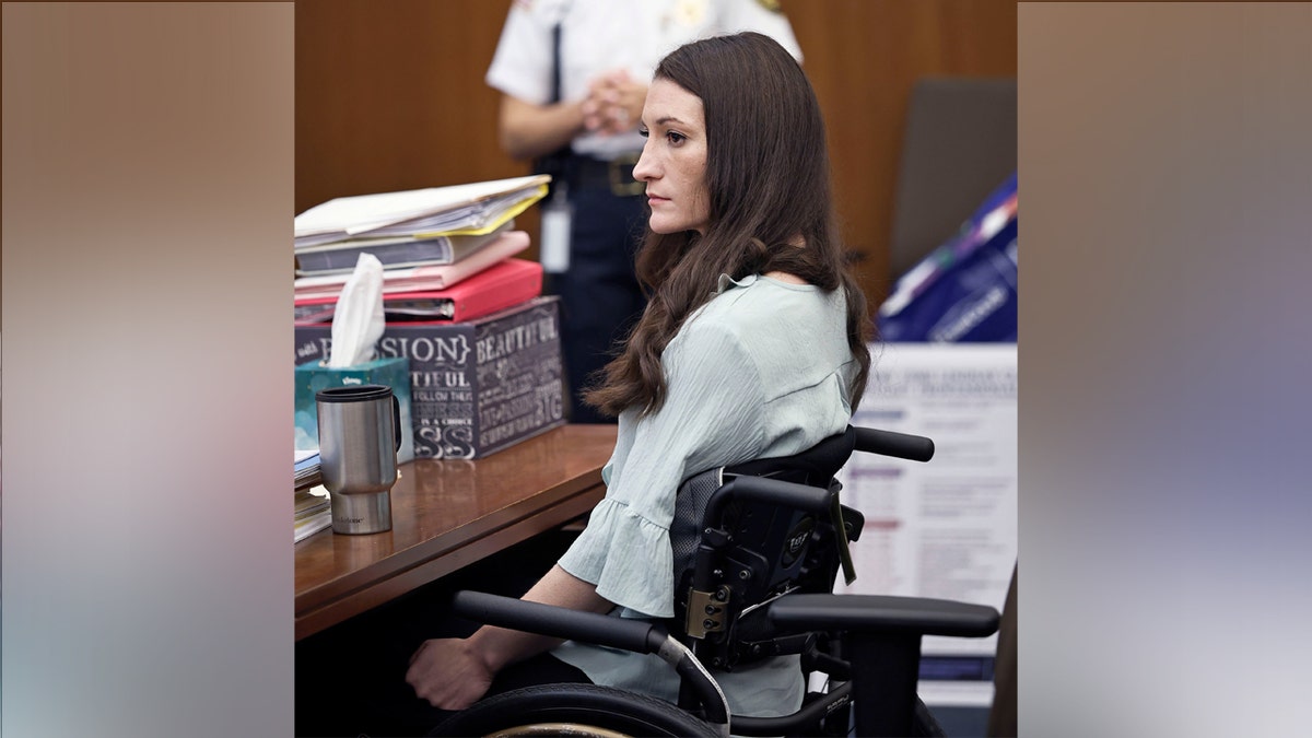 Lindsay Clancy sits in wheelchair during trial.