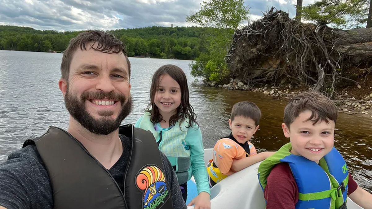 Jesse Morgan poses with children, including Lucy Morgan, on a boat during the family’s Maine vacation in 2024