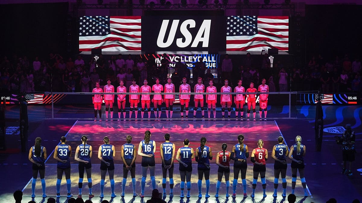 Players stand during the opening ceremony in Macau, China.