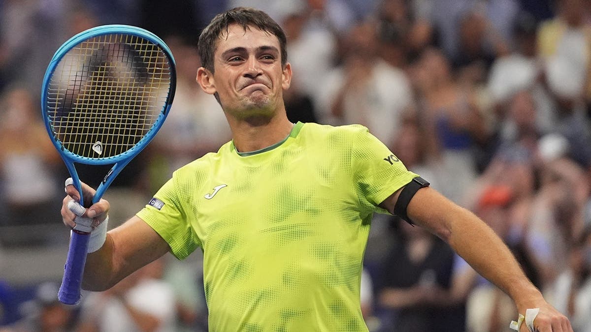 Mariano Navone of Argentina celebrates after defeating Novak Djokovic during the U.S. Open tennis match.