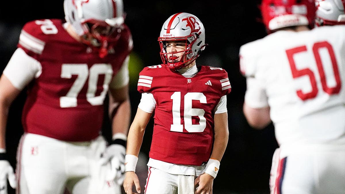 Marshall Manning, wearing number 16, gets in position against Brentwood Academy during a football game.