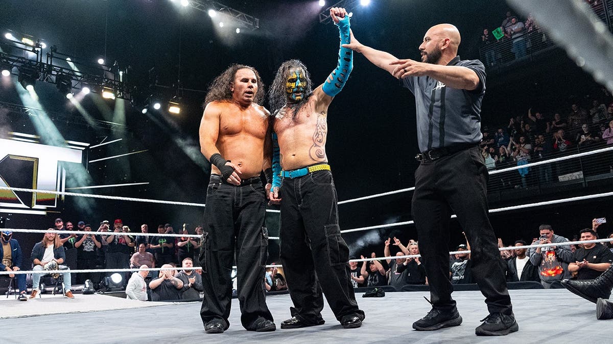 Matt Hardy and Jeff Hardy celebrate during NXT in Cincinnati.