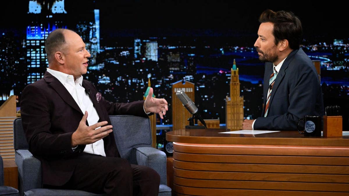 Matthew Berry speaks with Jimmy Fallon during an interview on The Tonight Show.