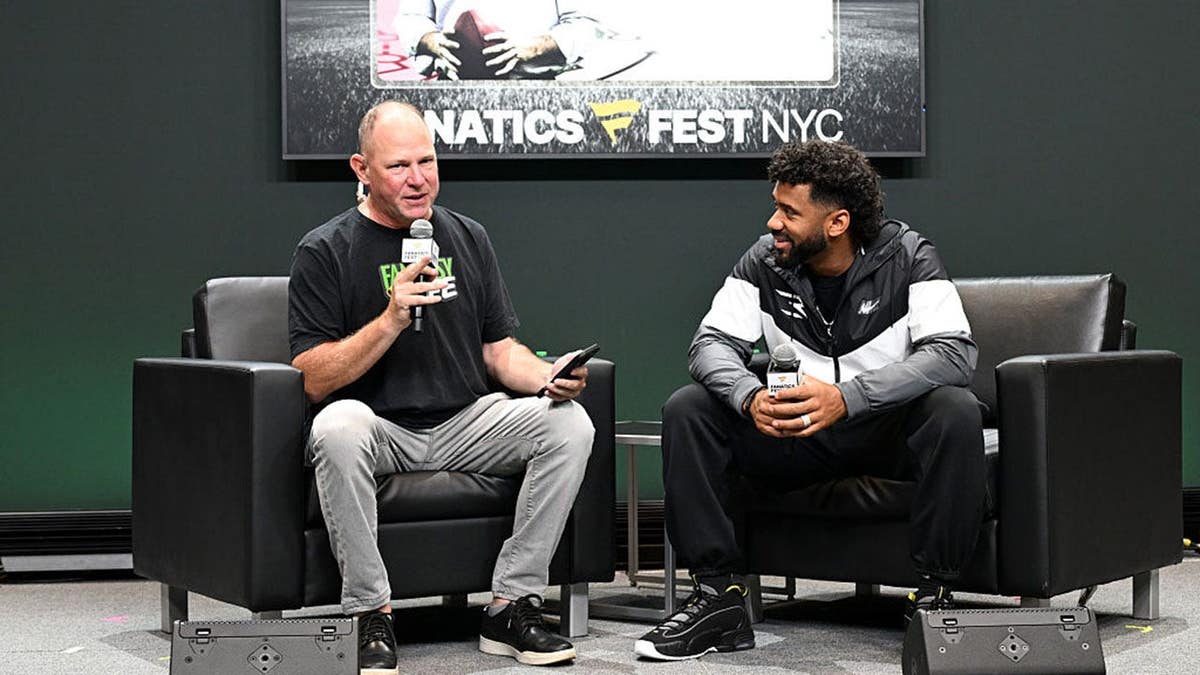 Matthew Berry and Russell Wilson speak onstage at Fanatics Fest NYC.