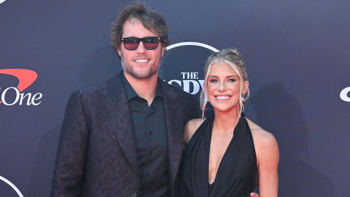Matthew Stafford and Kelly Hall stand together at the 2025 ESPY Awards.