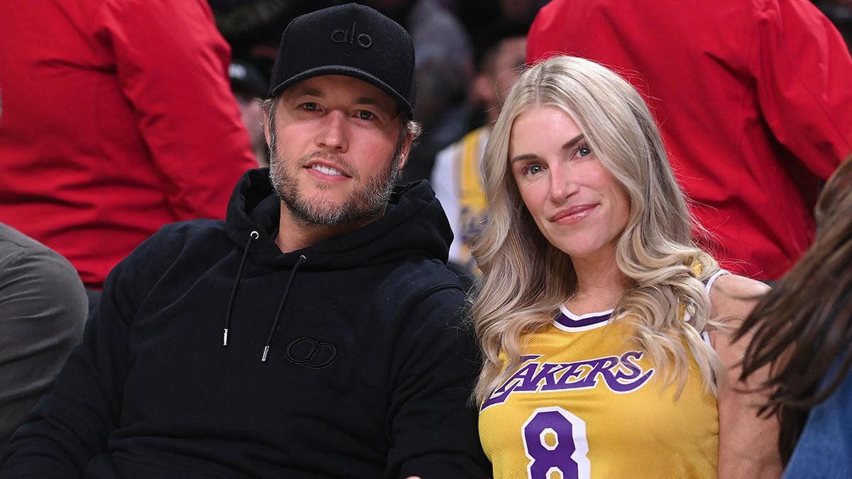 Matthew Stafford and Kelly Hall sit together at a Lakers-Rockets game.