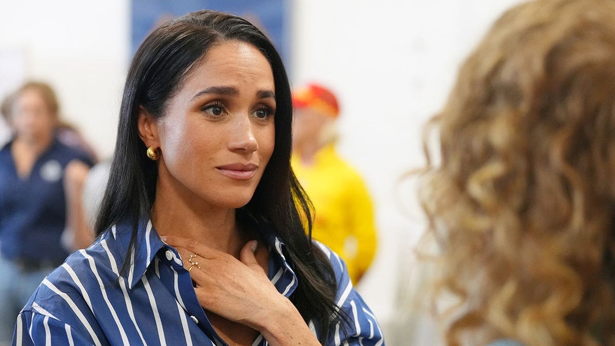 Meghan, Duchess of Sussex, meets volunteer first responders at Bondi Beach.