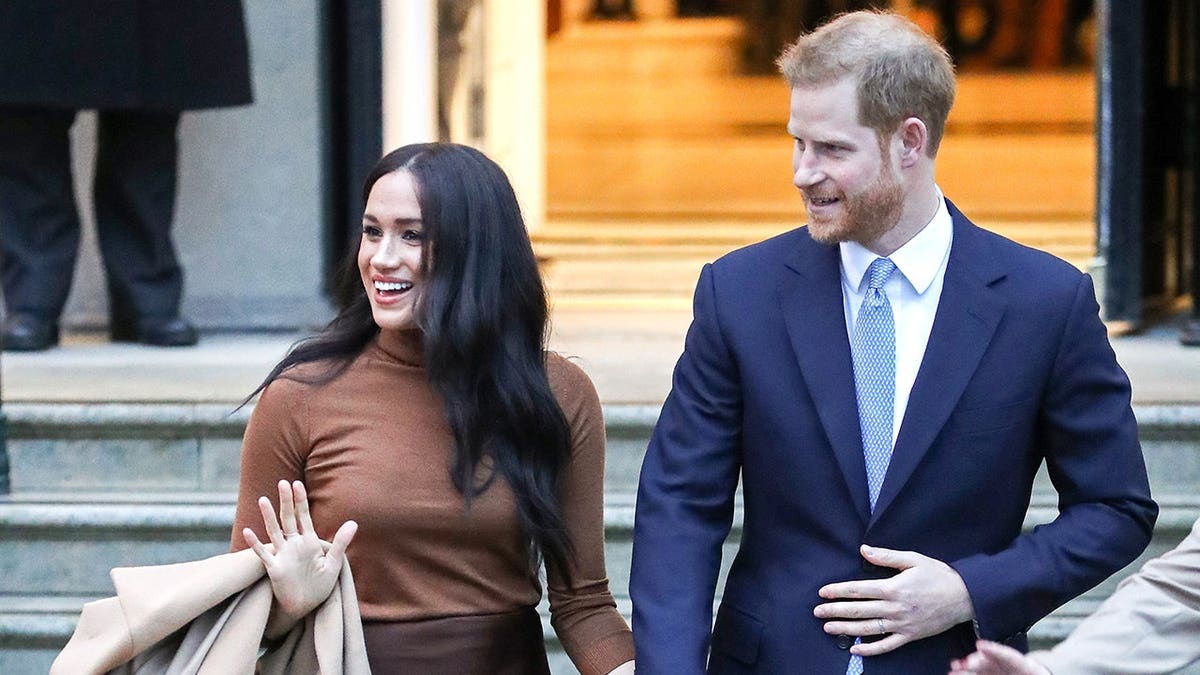 Meghan, Duchess of Sussex and Prince Harry depart Canada House in London.