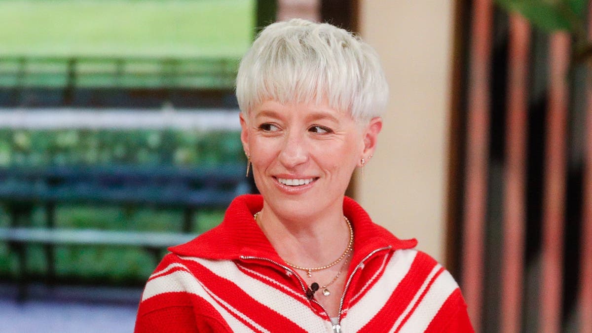Meghan Rapinoe and Timothy White seated on The View set.