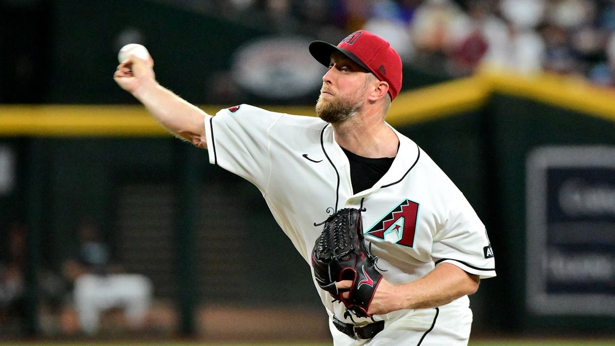 Merrill Kelly throws a pitch in the first inning at Chase Field.